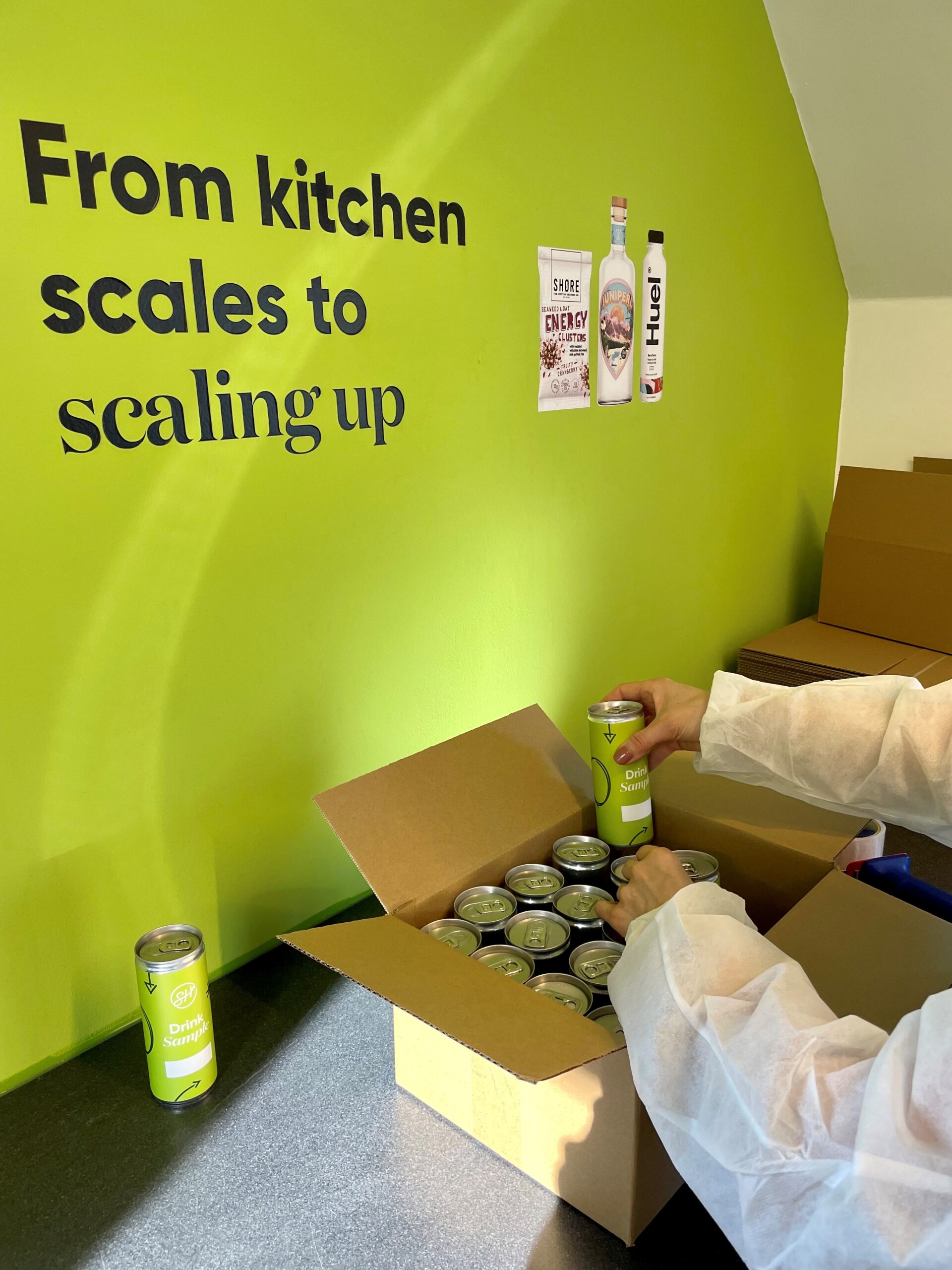 JO PACKING CANS INTO BOXES